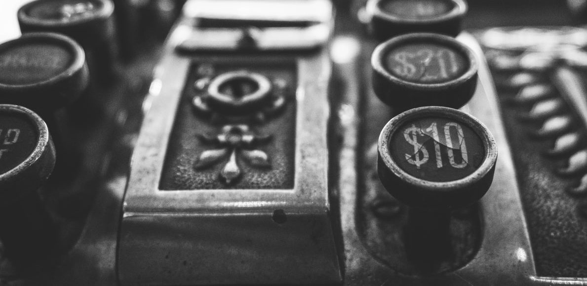 An illustrative image to the article on alternatives to GDP. A A black-and-white photo of an old cashier's machine.